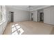 Spacious main bedroom featuring a light color palette, multiple doors, and an open layout at 207 Holleman St, Apex, NC 27502