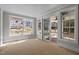 Bright sunroom with large windows and sliding doors leading to the outside at 207 Holleman St, Apex, NC 27502