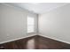 Bedroom with hardwood floors and window overlooking yard at 216 Kalmia Dr, Durham, NC 27703