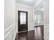 Inviting entryway featuring a decorative glass front door and rich hardwood flooring at 216 Kalmia Dr, Durham, NC 27703