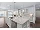 Spacious kitchen island with stainless steel dishwasher and granite countertops at 216 Kalmia Dr, Durham, NC 27703