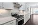 Stylish kitchen featuring granite countertops, stainless steel appliances, and modern cabinetry at 216 Kalmia Dr, Durham, NC 27703