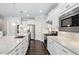 Modern kitchen with stainless steel appliances, granite countertops, and dark hardwood floors at 216 Kalmia Dr, Durham, NC 27703