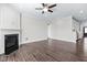 Open-concept living area with a fireplace and access to kitchen at 216 Kalmia Dr, Durham, NC 27703