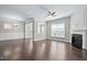 Open-concept living area with a fireplace, hardwood floors, and ample natural light at 216 Kalmia Dr, Durham, NC 27703