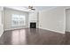 Spacious living room with a fireplace and dark hardwood flooring at 216 Kalmia Dr, Durham, NC 27703