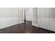 Bright office space with French doors, wainscoting detail, and hardwood floors at 216 Kalmia Dr, Durham, NC 27703