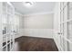 Well-lit office featuring French doors, wainscoting and large window at 216 Kalmia Dr, Durham, NC 27703