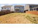 Expansive backyard with wooden deck and fence, offering privacy and space for outdoor activities at 2404 Glade Mill Ct, Fuquay Varina, NC 27526