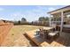 A spacious, fenced backyard features a wooden deck, perfect for outdoor entertaining and relaxation at 2404 Glade Mill Ct, Fuquay Varina, NC 27526