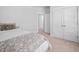 Bedroom featuring carpet, neutral walls, and a bed with a gray quilt at 2404 Glade Mill Ct, Fuquay Varina, NC 27526