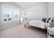 Bright bedroom featuring carpet, a bed with a white comforter and large windows at 2404 Glade Mill Ct, Fuquay Varina, NC 27526