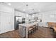 Bright kitchen with granite countertops, stainless steel appliances, and a convenient island at 2404 Glade Mill Ct, Fuquay Varina, NC 27526