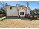 Exterior back view of home with a wood deck and lawn at 2428 Havershire Dr, Raleigh, NC 27613