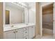 Bathroom featuring double sinks, a large mirror and vanity with plenty of storage space at 2428 Havershire Dr, Raleigh, NC 27613