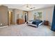 Spacious bedroom featuring carpeted floors, and natural light through a large window at 2428 Havershire Dr, Raleigh, NC 27613