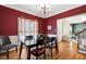 Elegant dining room with hardwood floors, wainscoting, and a stylish chandelier at 2428 Havershire Dr, Raleigh, NC 27613