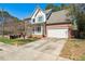 Brick front exterior with attached garage and established landscaping at 2428 Havershire Dr, Raleigh, NC 27613
