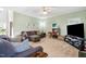 Bright and airy living room featuring neutral tones, comfortable seating, and ample natural light at 2428 Havershire Dr, Raleigh, NC 27613