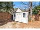 Backyard storage shed with access doors and windows at 2428 Havershire Dr, Raleigh, NC 27613
