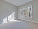 Light-filled bedroom with large window offers a relaxing space at 273 Homestead Way, Clayton, NC 27527