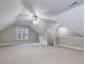 Spacious bonus room with neutral carpet and good natural light from the window at 273 Homestead Way, Clayton, NC 27527
