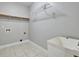 Functional laundry room with sink and storage features at 273 Homestead Way, Clayton, NC 27527