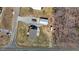 Aerial view of home with a rear wooden deck, driveway, and detached building at 3307 Altamahaw Church St, Elon, NC 27244