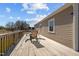 Spacious wooden deck with seating, ideal for outdoor dining and entertaining at 3307 Altamahaw Church St, Elon, NC 27244