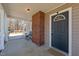 Covered front porch with brick column and space for seating by front door at 3307 Altamahaw Church St, Elon, NC 27244