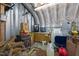 Interior view of a metal shop building with wood burning stove and utility sink with water heater at 3307 Altamahaw Church St, Elon, NC 27244