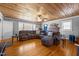 Spacious living room with hardwood floors, ample seating, and natural light at 3307 Altamahaw Church St, Elon, NC 27244