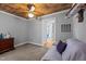 Wood ceiling living room with comfortable seating, dresser and an open view into bathroom at 3307 Altamahaw Church St, Elon, NC 27244