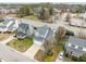 High angle view of the property showcases the home's layout, front yard, and surrounding neighborhood at 3809 Mardela Spring Dr, Raleigh, NC 27616