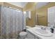 This bathroom features a cream colored wall and white sink and toilet at 3809 Mardela Spring Dr, Raleigh, NC 27616