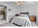 This bedroom has two-tone walls, neutral carpet, and a view to an adjoining bathroom at 3809 Mardela Spring Dr, Raleigh, NC 27616