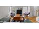 Cozy living room with hardwood floors, large windows, and a comfortable seating arrangement for relaxing at 3809 Mardela Spring Dr, Raleigh, NC 27616