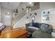 Inviting living room showcasing an open floor plan and a staircase leading to the second level at 3809 Mardela Spring Dr, Raleigh, NC 27616