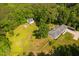Picturesque property featuring a home, outbuilding, greenhouse, and fenced perimeter at 4200 Us 1 Highway South, Kittrell, NC 27544