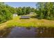 Aerial view of home with solar panels and a pond at 4200 Us 1 Highway South, Kittrell, NC 27544