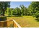 Large grassy back yard with mature trees at 4200 Us 1 Highway South, Kittrell, NC 27544