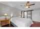 Bedroom featuring a decorative sliding barn door with window, and two windows at 4200 Us 1 Highway South, Kittrell, NC 27544