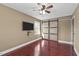 Modern bedroom with flat-screen TV, barn door closet, and a ceiling fan at 4200 Us 1 Highway South, Kittrell, NC 27544