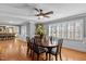 Spacious dining room with hardwood floors, a ceiling fan, and large windows offering plenty of natural light at 4200 Us 1 Highway South, Kittrell, NC 27544