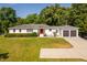 Aerial view of a ranch-style home with landscaped yard, concrete driveway, and an attached two-car garage at 4200 Us 1 Highway South, Kittrell, NC 27544