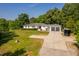 Well-maintained white home featuring an attached garage and manicured lawn at 4200 Us 1 Highway South, Kittrell, NC 27544