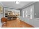 Elegant foyer featuring hardwood floors and open access to a modern kitchen with bar seating at 4200 Us 1 Highway South, Kittrell, NC 27544