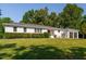 Charming white-brick home with well-kept landscaping, complete with a convenient attached garage at 4200 Us 1 Highway South, Kittrell, NC 27544