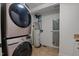 Laundry room with stacked washer/dryer, water heater and Generac battery backup at 4200 Us 1 Highway South, Kittrell, NC 27544