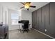 Bedroom with a ceiling fan and closet space, well-lit with natural light at 5332 Seaspray Ln, Raleigh, NC 27610